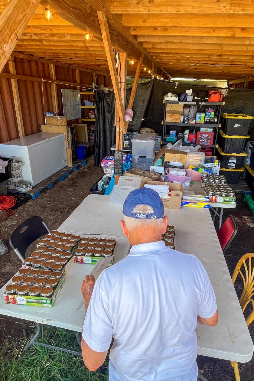 A man looks over items on a table