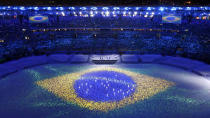 <p>The Brazilian flag is seen projected during the closing ceremony of the 2016 Rio Olympics on August 21, 2016. (REUTERS/Fabrizio Bensch) </p>
