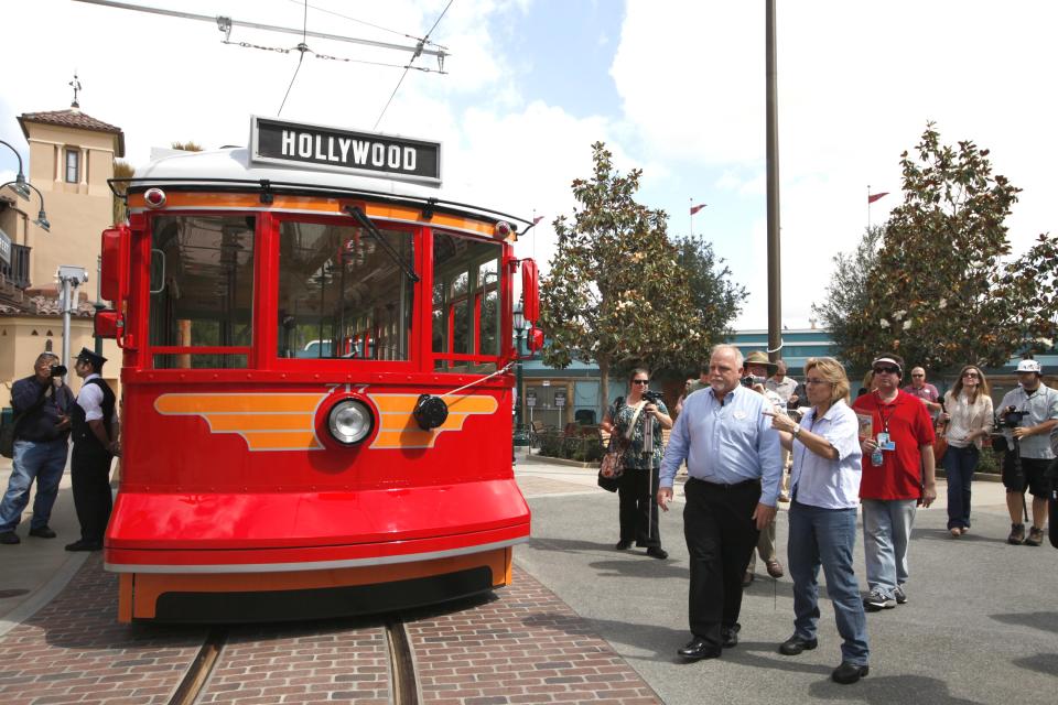 This June 5, 2012 photo shows Ray Spencer, creative director of Buena Vista Street, and Lisa Girolami, senior show producer, right, during a media tour os Buena Vista Street at Disney California Adventure Park in Anaheim, Calif. The park's five-year, $1 billion-plus revamp has debuted in spurts since 2008. Most of its new features rely on characters that come from Disney's $7.4 billion acquisition of Pixar Animation Studios, the San Francisco-area studio behind "Cars," `'Toy Story," `'Monsters Inc." and "A Bug's Life." (AP Photo/Nick Ut)