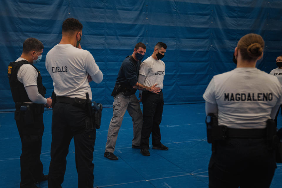 Instructor Javier Sola teaches frisking and handcuffing methods to future law enforcement officers at the state-run training facility in Washington state.<span class="copyright">Jovelle Tamayo for TIME</span>