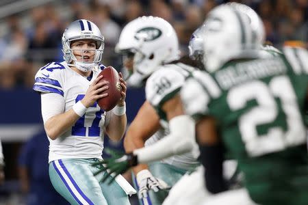 Dec 19, 2015; Arlington, TX, USA; Dallas Cowboys quarterback Kellen Moore (17) looks to throw from the pocket during the third quarter against the New York Jets at AT&T Stadium. New York won 19-16. Mandatory Credit: Tim Heitman-USA TODAY Sports