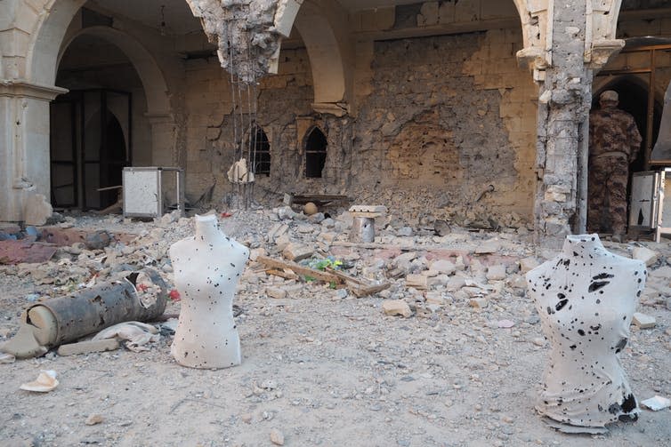 <span class="caption">The courtyard outside the Cathedral in Quaragosh, Iraq, used by Daesh as a shooting range.</span> <span class="attribution"><span class="source">Ewelina Ochab</span>, <span class="license">Author provided</span></span>