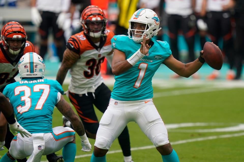 Miami Dolphins quarterback Tua Tagovailoa, seen here in a game against the Bengals in 2020, is battling injuries and may not play against Cincinnati on Thursday night.