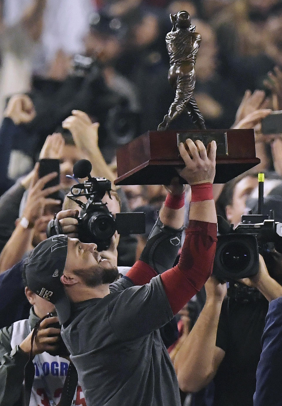 Boston Red Sox's Steve Pearce holds the MVP trophy after Game 5 of baseball's World Series against the Los Angeles Dodgers on Sunday, Oct. 28, 2018, in Los Angeles. The Red Sox won 5-1 to win the series 4 game to 1. (AP Photo/Mark J. Terrill)