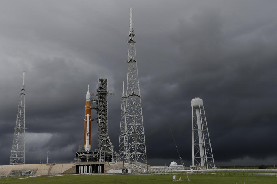 FILE - NASA's new moon rocket sits on Launch Pad 39-B under stormy skies Sunday, Nov. 13, 2022, in Cape Canaveral, Fla. The 21st-century moon-exploration program is named Artemis, after Apollo's mythological twin sister. (AP Photo/John Raoux, File)