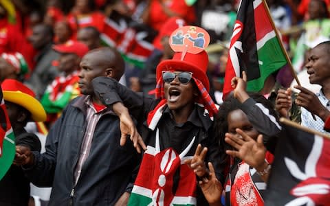 Supporters in the stand attend the presidential inauguration at Kasarani stadium in Nairobi, Kenya Tuesday, Nov. 28 - Credit: Ben Curtis/AP