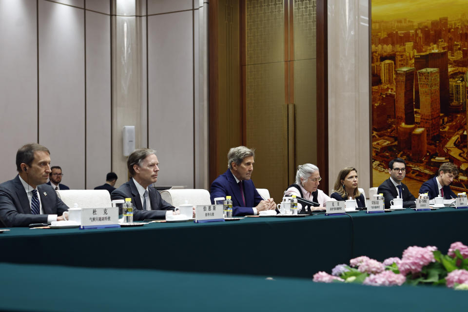 U.S. Special Presidential Envoy for Climate John Kerry, third left, attends a meeting with Chinese top diplomat Wang Yi, not pictured, at the Great Hall of the People in Beijing Tuesday, July 18, 2023. (Florence Lo/Pool Photo via AP)
