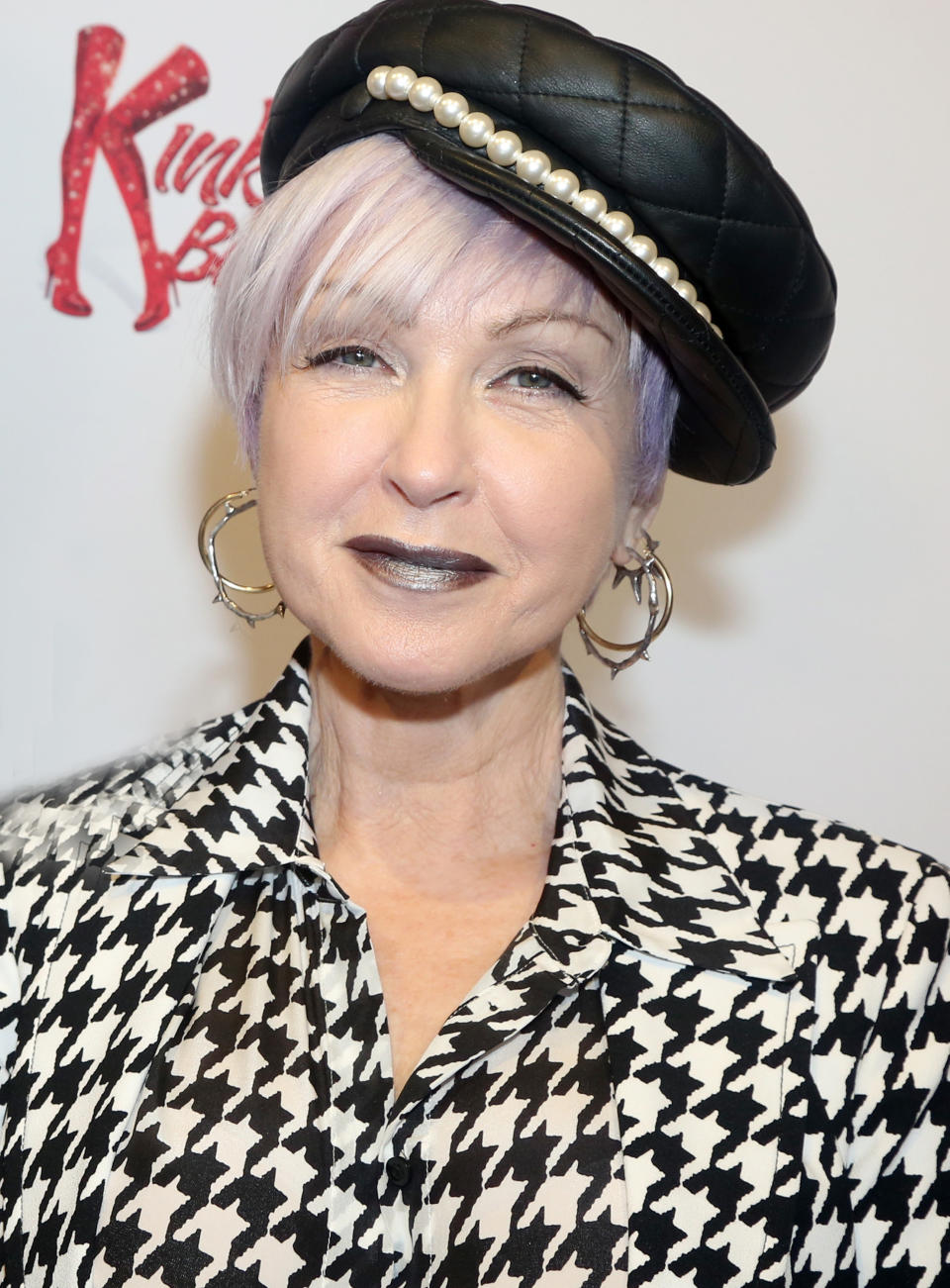 Cyndi Lauper posing on a red carpet