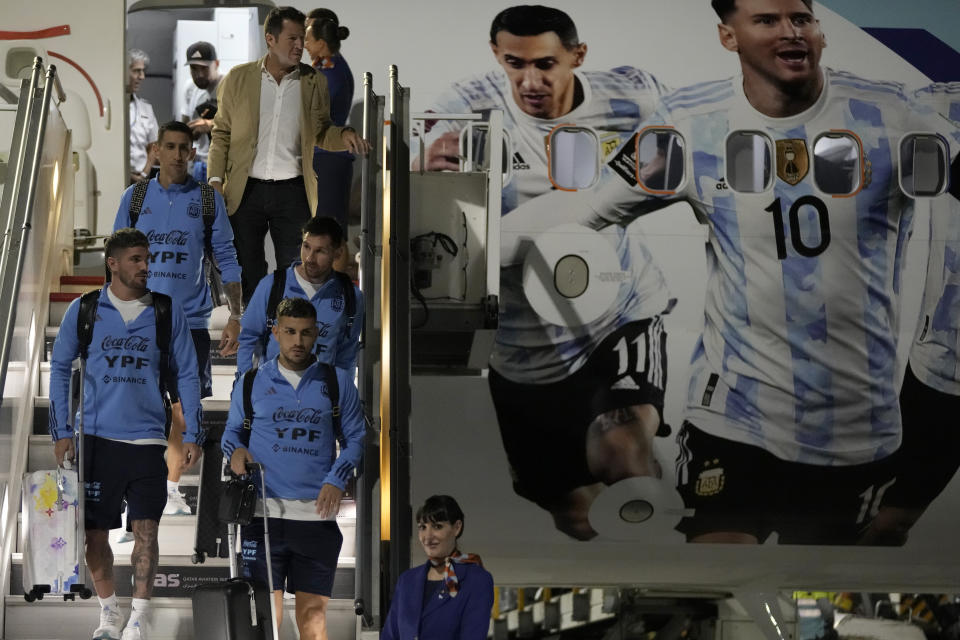 Lionel Messi, second right, of Argentina's national soccer team arrives with teammates at Hamad International airport in Doha, Qatar, Thursday, Nov. 17, 2022 ahead of the upcoming World Cup. Argentina will play the first match in the World Cup against Saudi Arabia on Nov. 22. (AP Photo/Hassan Ammar)