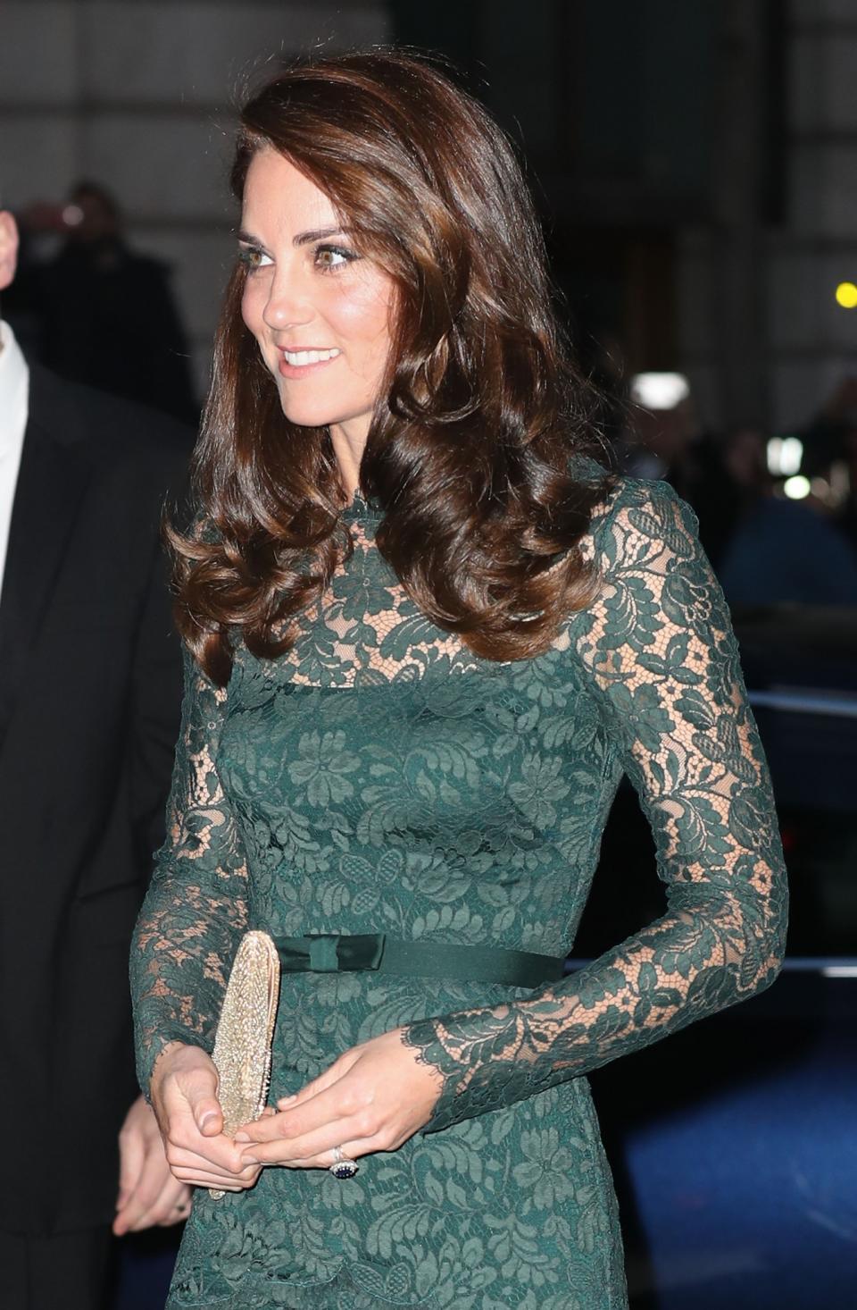 Her hair was styled in its usual bouncy curls and side parting.