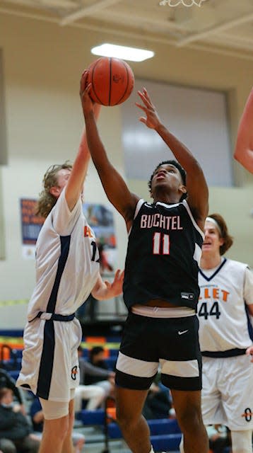 Buchtel's Marcel Boyce Jr., photographed going up for a shot in a win on Friday at Ellet, helped guide the Griffins to a win over Dayton Dunbar on Sunday in the Flyin' To The Hoop Invitational at Kettering Fairmont.