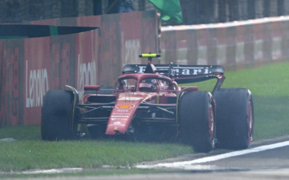 Ferrari's Spanish driver Carlos Sainz Jr sits on the side of the track during the qualifying session for the Formula One Chinese Grand Prix at the Shanghai International Circuit in Shanghai on April 20, 2024.