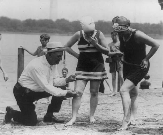 Image of women being policed on modesty by officer on beach 1922