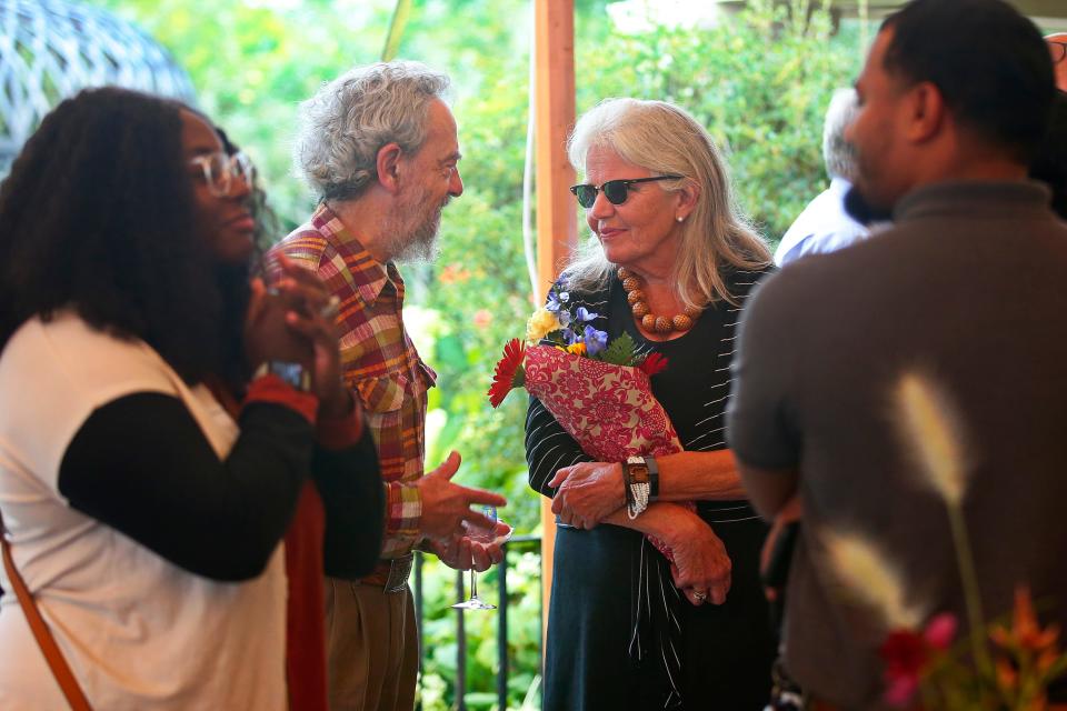 AHA! program director, Candace Lee Heald speaks with attendees to her retirement party held at the Rotch Jones Duff house in New Bedford.