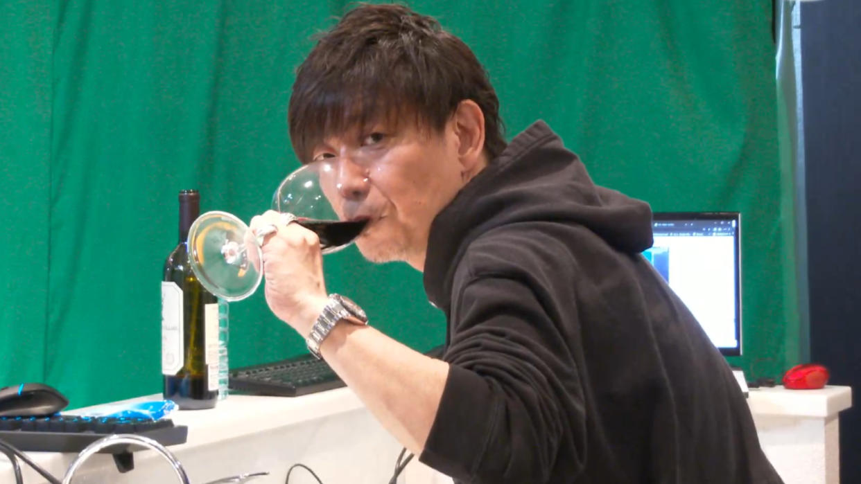  Naoki Yoshida drinking red wine. 