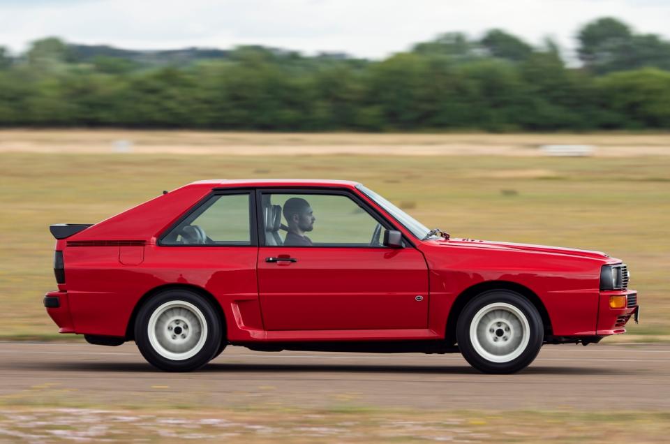<p>Although immediately revered as a road car handling benchmark, Audi’s ur-quattro didn’t <em>quite</em> translate its prowess into the degree of deft nimbleness required for it to be an utterly dominant rallying weapon. Enter the gawky Sport quattro to the stage in 1984. </p><p>Using the shell of the 80 as its starting point — its more upright windscreen creating fewer <strong>dashboard reflections</strong> than the sleeker Coupé-based quattro — this was another low-volume homologation special, with just 224 produced. </p><p>Not only was power boosted to 302bhp, the Sport quattro’s shorter, wider bodywork made it look brutal, at least until you saw it side-on. Then the 320mm that had been chopped from the wheelbase — dropping the proportion of length to <strong>52.88%</strong> — became uncomfortably obvious. Still, you can’t see that when you’re Scandi flicking your way to the shops. </p>