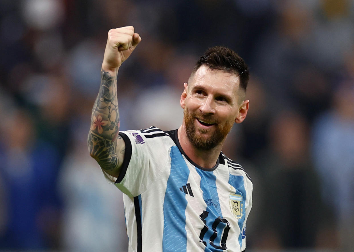 Argentina's Lionel Messi pumps his fist after Julian Alvarez scores their third goal against Croatia at the World Cup semi-finals.