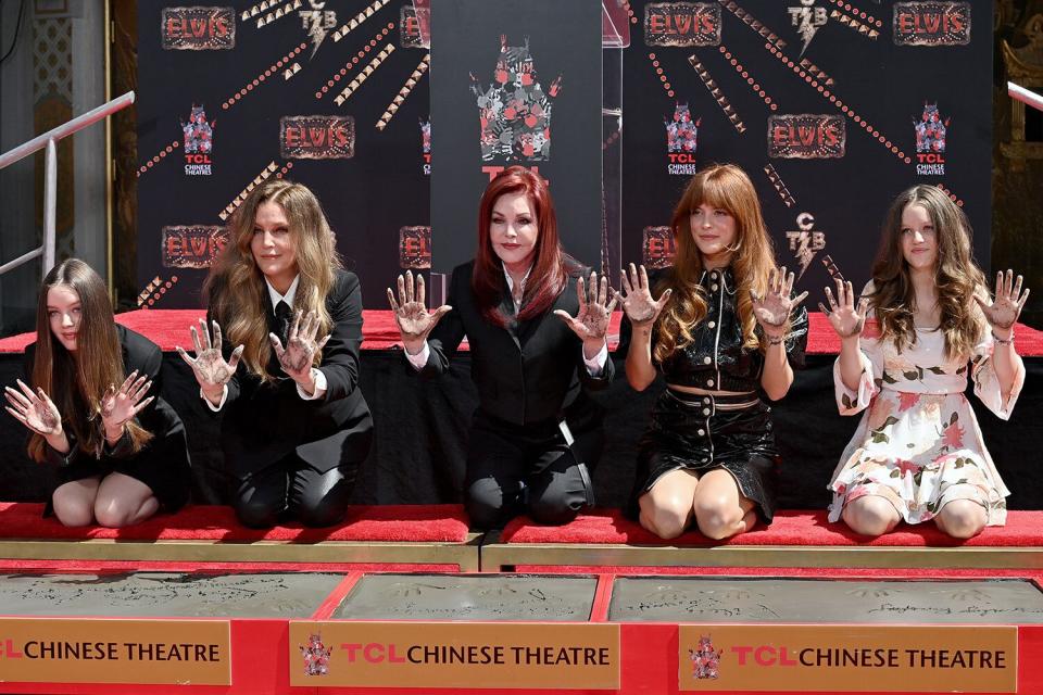 HOLLYWOOD, CALIFORNIA - JUNE 21: (L-R) Harper Vivienne Ann Lockwood, Lisa Marie Presley, Priscilla Presley, Riley Keough, and Finley Aaron Love Lockwood attend the Handprint Ceremony honoring Three Generations of Presley's at TCL Chinese Theatre on June 21, 2022 in Hollywood, California. (Photo by Axelle/Bauer-Griffin/FilmMagic)