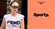 <p>Model Gigi Hadid is leading the sport-eyewear trend. She was recently spotted out in New York City wearing a pair of blue tinted sporty sunglasses by Westward Leaning, paired with a Fendi logo tee and denim jeans. (Photo: Getty Images; art: Quinn Lemmers for Yahoo Lifestyle) </p>