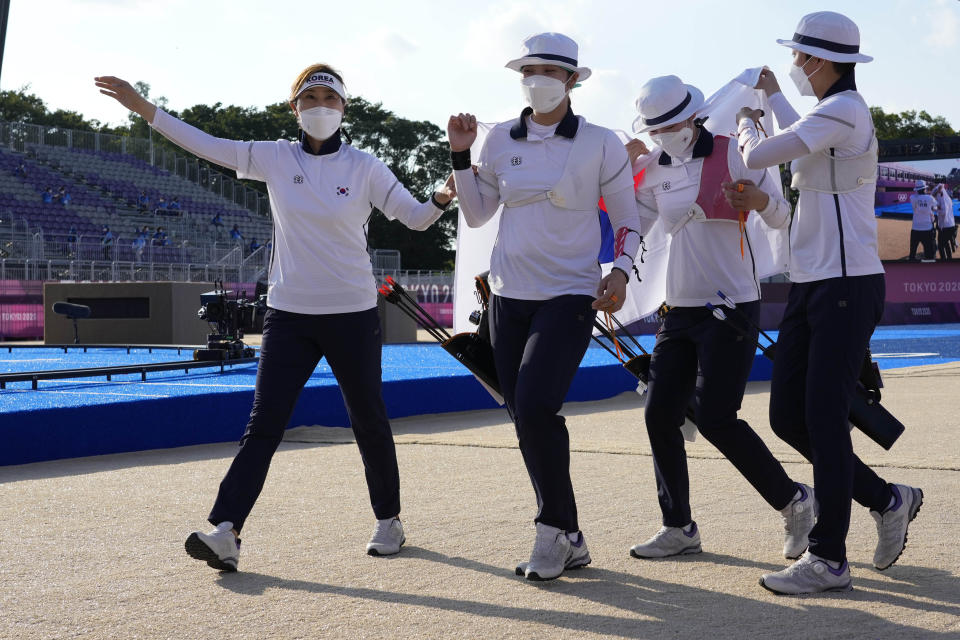 Athletes of South Korea celebrate after winning the women's team competition final against the team of the Russian Olympic Committee at the 2020 Summer Olympics, Sunday, July 25, 2021, in Tokyo, Japan. (AP Photo/Alessandra Tarantino)