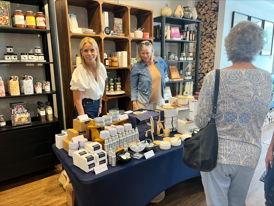 Actress Cheryl Hines samples products from her Hines+Young collection during a pop-up launch event at Hearth and Soul.