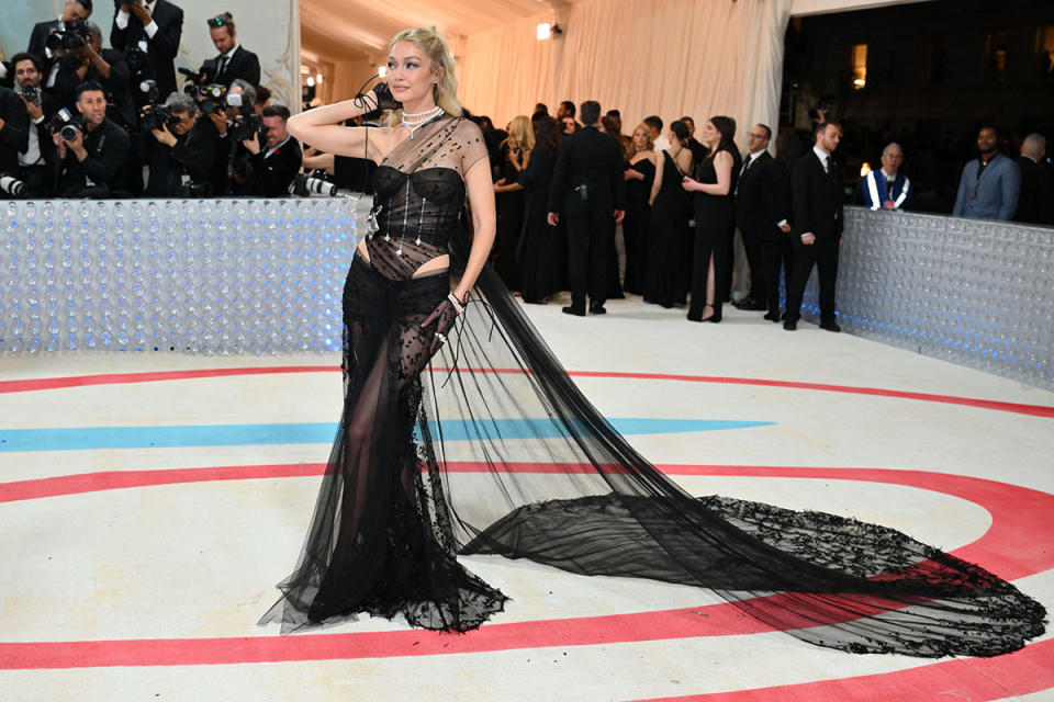 The model chose a see-through dress with a dramatic train. Photo: Getty