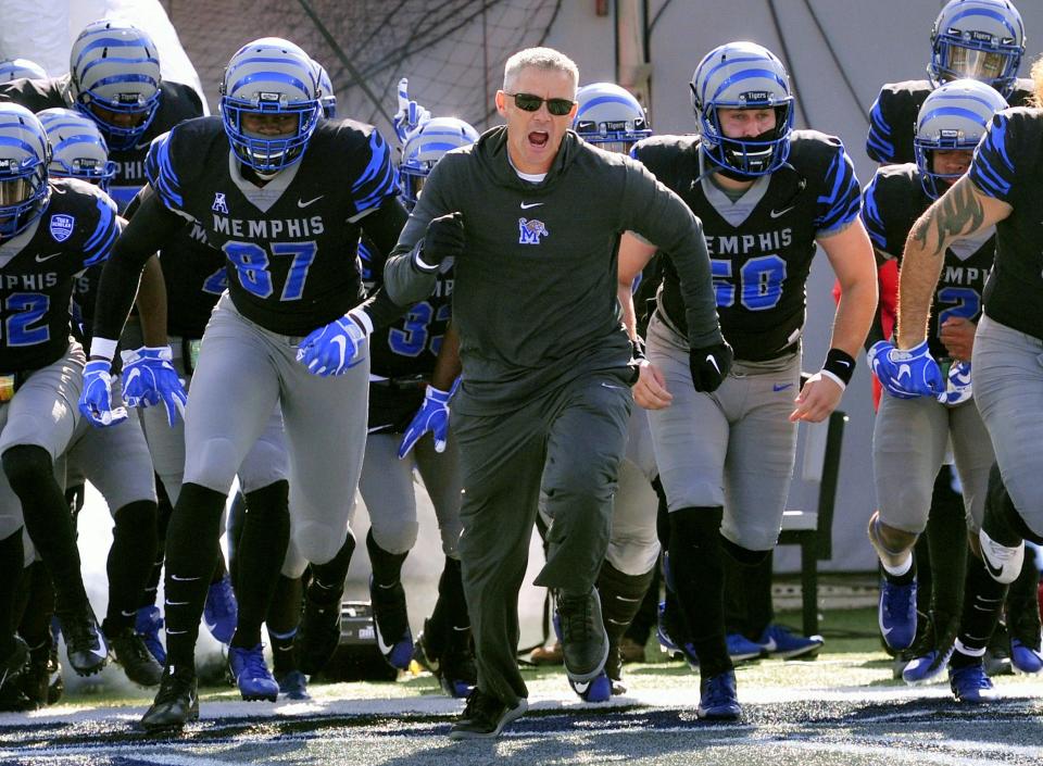 Nov 10, 2018; Memphis, TN, USA; Memphis Tigers head coach Mike Norvell runs on to the field against the Tulsa Golden Hurricane before a game at Liberty Bowl Memorial Stadium. Mandatory Credit: Justin Ford-USA TODAY Sports