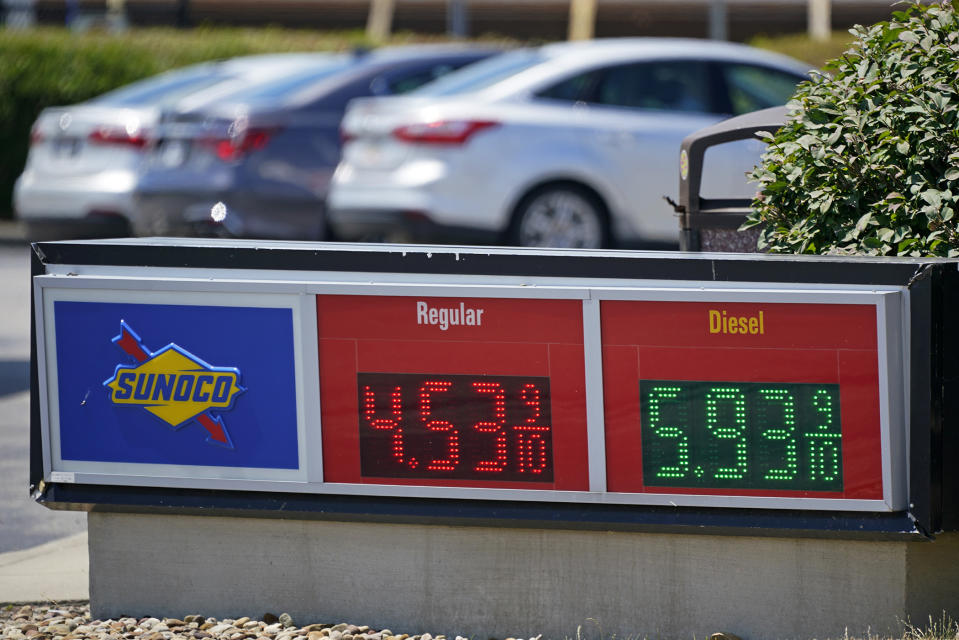 FILE - Gas prices are displayed at a Sunoco gas station along the Ohio Turnpike near Youngstown, Ohio, Tuesday, July 12, 2022. U.S. consumer confidence slid again in July 2022, as concerns about higher prices for food, gas and just about everything else continued to weigh on Americans. The Conference Board said Tuesday, July 26, 2022, that its consumer confidence index fell to 95.7 in July from 98.4 in June, largely due to consumers' anxiety over the current conditions, particularly four-decade high inflation. (AP Photo/Gene J. Puskar, File)