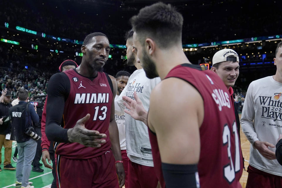 Miami Heat center Bam Adebayo (13) celebrates with guard Max Strus (31) after they defeated the Boston Celtics in Game 2 of the NBA basketball playoffs Eastern Conference finals in Boston, Friday, May 19, 2023. (AP Photo/Charles Krupa)