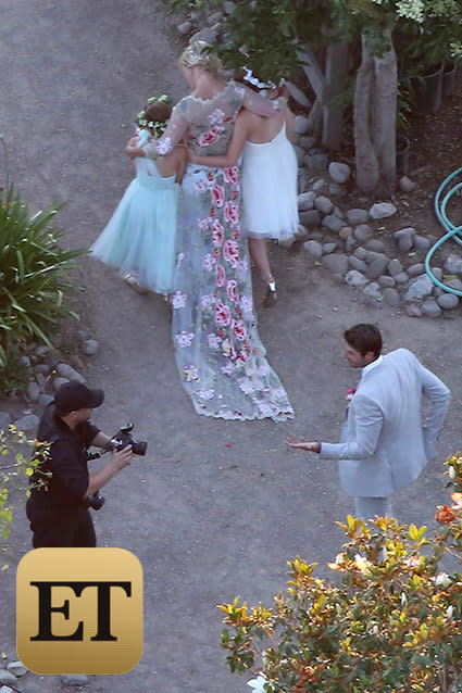 Who's got the tissues? There was hardly a dry eye on the ranch when Jennie Garth married actor-producer Dave Abrams at her farmhouse in Los Olivos, Calif., Saturday evening. <strong>NEWS: Jennie Garth Marries Dave Abrams</strong> The blushing bride, decked out in a floral-embroidered gown with a sheer long-sleeve overlay -- looked extremely happy but a little nervous as she walked down the aisle solo, a source tells ET. She had no reason to be concerned, though -- Abrams, looking sharp in a light gray suit, lit up as soon as he saw his bride-to-be in her wedding gown for the first time. FameFlynet FameFlynet Aw! Everything about the wedding was traditional and intimate, from the close friends and family in attendance at Garth's Santa Ynez Valley home to all three of Jennie's daughters -- Luca Bella, 17, Lola Ray, 12, and Fiona Eve, 8 -- looking on as her beautiful, excited bridesmaids. FameFlynet FameFlynet <strong>PHOTOS: Gorgeous Celeb Wedding Dresses </strong> The most poignant part of the wedding, however, was when it came time to exchange vows. Both bride and groom stood in front of a white archway framed by peach tulle and flowers and clutched folders as they shared their own "very emotional" vows, the source said. Garth even had to dry her eyes at one point during Abrams' speech. FameFlynet FameFlynet After Garth and Abrams were declared man and wife, all of the attendees jumped to their feet to congratulate the newly married couple. The doting duo gave the bridesmaids, who were sporting adorable floral headbands, big hugs, embracing them as they walked to an open area of the ranch to take official wedding photos. FameFlynet ETONLINE Guests were treated to a reception full of rustic elegance, with chic, simple white shades, lawn lamps and dividers framing the yard and white linens and plates placed on dark wooden picnic tables to add to the cozy feel. FameFlynet Romance stayed in the air (but how could it not?) as the couple stepped into the spotlight to dance to Elton John's "Your Song," which is about as sweet a song as one can pick. <strong>WATCH: Third Times the Charm for These 9 Lovesick Celebrities </strong> There was plenty of fun music for all of the attendees to dance to as well, with the party going strong to lovestruck tunes like The Eagles' "Best of My Love," The Four Tops' "Ain't No Woman (Like the One I've Got)," John Legend's "P.D.A. (We Just Don't Care)" and Michael Jackson's "Rock With You." Who were some of the fabulous attendees dancing the night away? They included Garth's BFFs, of course, like her <em>Beverly Hills, 90210</em> co-star Tori Spelling. While her husband Dean McDermott and fellow <em>90210</em> castmates weren't at the ranch, Spelling still had an amazing time celebrating Garth's nuptials alongside costume designer Erik Rudy and actor Miguel Pinzon. FameFlynet While he couldn't be in attendance, ET caught up with Ian Ziering at Comic-Con in San Diego on Saturday, and he shared his love and well wishes for his <em>90210</em> co-star on her special day. "Jennie is such a special person," he said. "She's so fantastic. I was hoping that she’d be able to find love again, and knowing her, I'm not surprised that it's happened." <strong>PHOTOS: Inside Vanessa Williams' Lavish Wedding </strong> Third time was definitely the charm for Garth, who was previously married to <em>Twilight</em> star Peter Facinelli -- with whom she has Luca, Lola and Fiona -- from 2001 to 2013 and Daniel Clark from 1994 to 1996. Garth and Abrams met on a blind date last fall and got engaged in April. There are even more big celeb weddings coming up this summer and fall -- find out which ones we're most excited for in the video below.