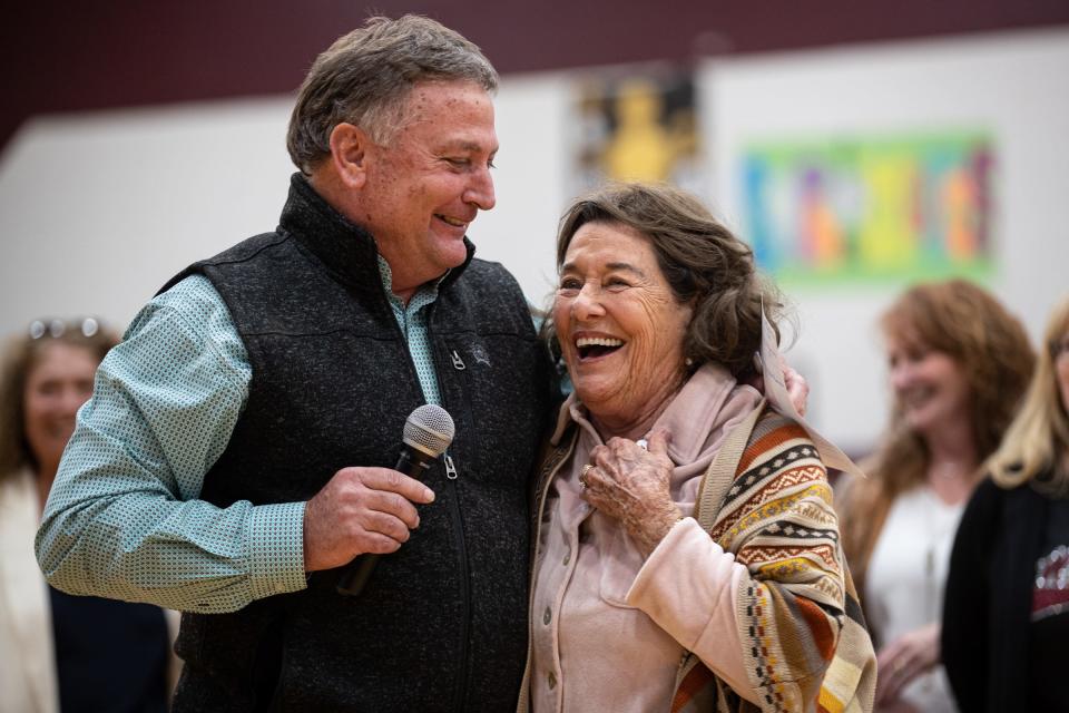 Calallen athletic director Steve Campbell hugs former Calallen girls basketball coach Leta Andrews during a gym dedication ceremony in her honor at Calallen High School on Friday, Jan. 13, 2023, in Corpus Christi, Texas.