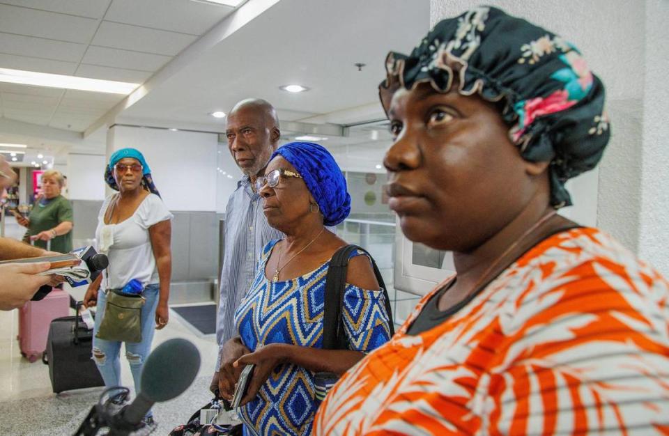 Moise Berthold, Acephie Etienne and Ashely Norilus were among a group of travelers who arrived at Miami International Airport in the second State Department evacuation flight from Haiti’s Cap-Haïtien International Airport, on Thursday March 21, 2024. Pedro Portal