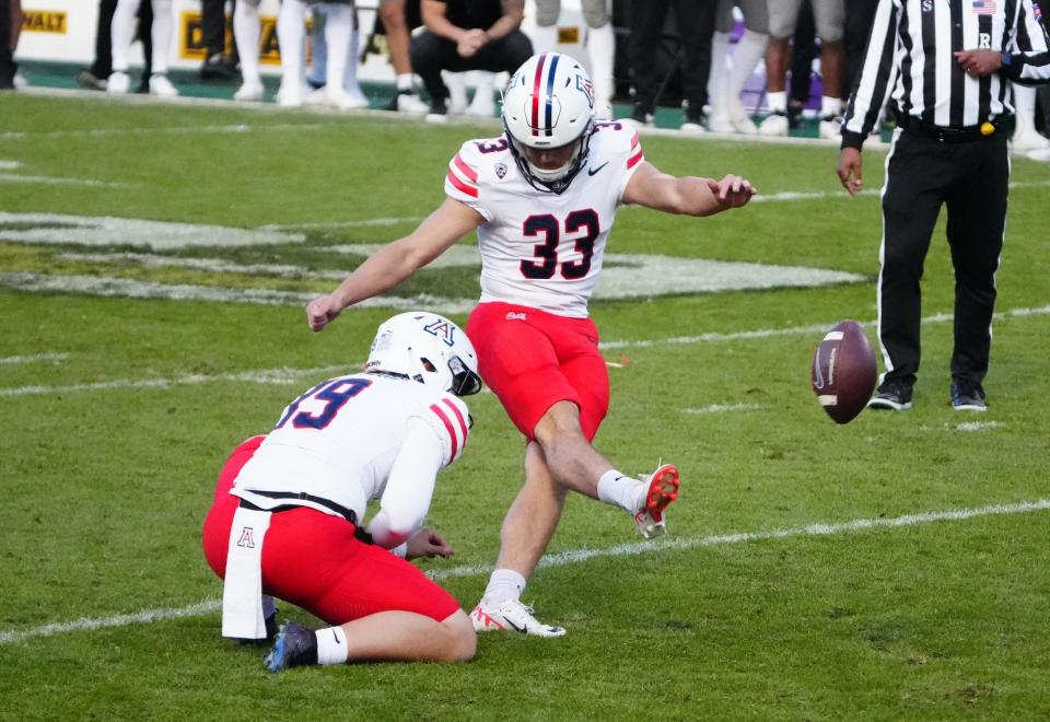 Arizona Wildcats place kicker Tyler Loop (33) kicks the winning field goal in the fourth quarter against the Colorado Buffaloes at Folsom Field Nov. 11 in Boulder, Colorado.