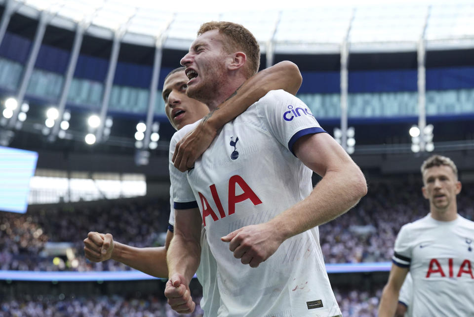 Tottenham's Dejan Kulusevski, right, celebrates with teammate Richarlison after scoring their side's second goal of the game during the English Premier League soccer match between Tottenham Hotspur and Sheffield United at the Tottenham Hotspur Stadium, London, Saturday, Sept. 16, 2023. (Jonathan Brady/PA via AP)