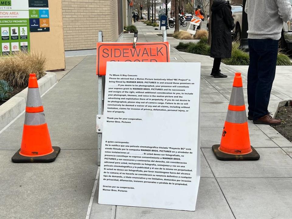 Warner Bros. film crews placed a sign on the sidewalk at Sixth and J streets, as shooting for filmmaker Paul Thomas Anderson’s new movie, “BC Project,” continues in downtown Sacramento. It advises people that anyone near the premise of the movie set is giving consent to the production to include their photos and likeness.