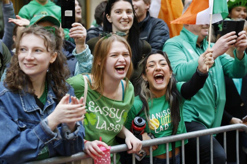 Parade goers cheer as participants in the St. Patrick's Day Parade march up Fifth Avenue in New York City on Saturday. Photo by John Angelillo/UPI