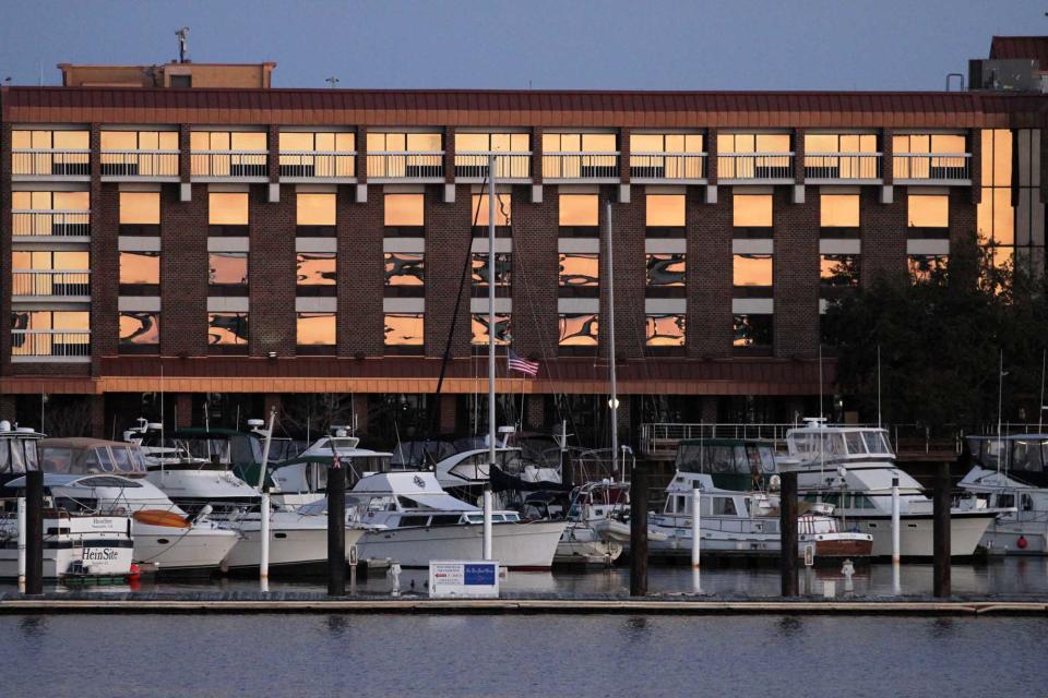 A view of the DoubleTree Hotel overlooking New Bern Grand Marina in New Bern, NC. The hotel, meeting spaces, restaraunt, bar and 99 guest rooms have been renovated following storm damage during Hurricane Florence in 2018. Reopening of the DoubleTree Hotel is scheduled for November, 2020. [Gray Whitley / Sun Journal Staff]