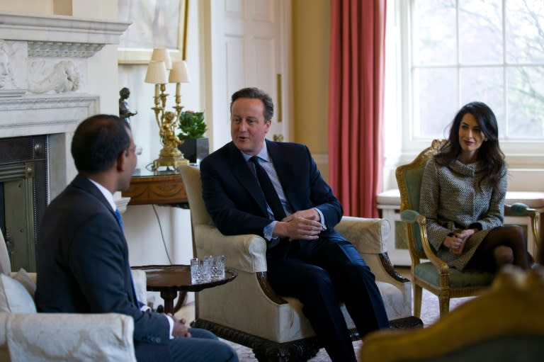 Prime Minister David Cameron (C) meets with former Maldives president Mohamed Nasheed (L) and British lawyer Amal Clooney inside 10 Downing Street in London on January 23, 2016