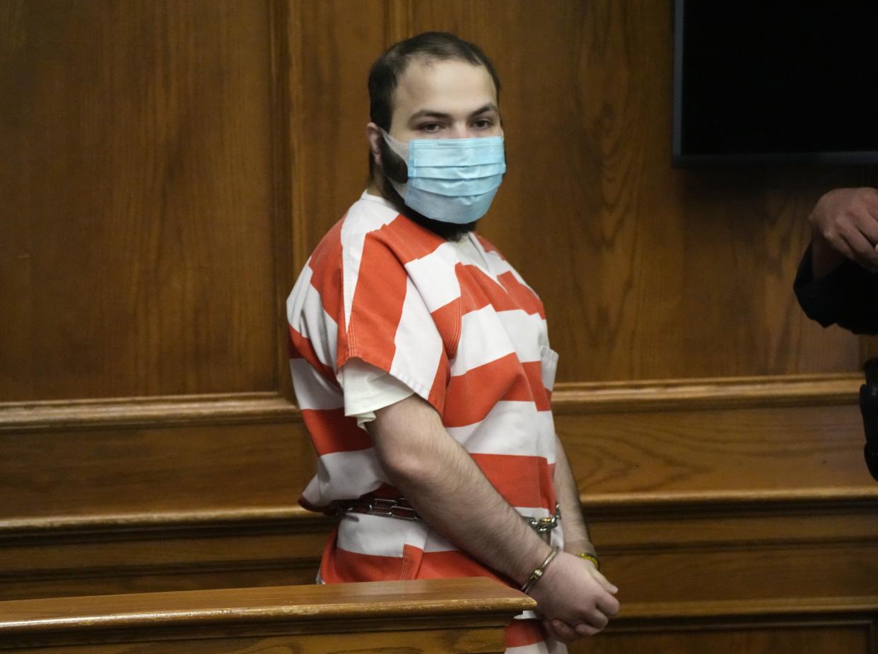 Ahmad Al Aliwi Alissa, accused of killing 10 people at a Colorado supermarket in March, is led into a courtroom for a hearing on Sept. 7, 2021, in Boulder, Colo.