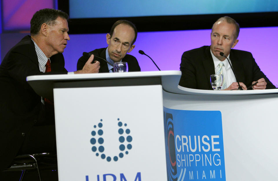 Gerald Cahill, President and CEO of Carnival Cruise Lines, left, speaks as Adam Goldstein, President and CEO of Royal Caribbean International, center, and Daniel Hanrahan, President and CEO of Celebrity Cruises, right, listen during a roundtable discussion on the state of the cruise ship industry at the Cruise Shipping Miami conference, Tuesday, March 13, 2012, in Miami Beach, Fla. (AP Photo/Lynne Sladky)