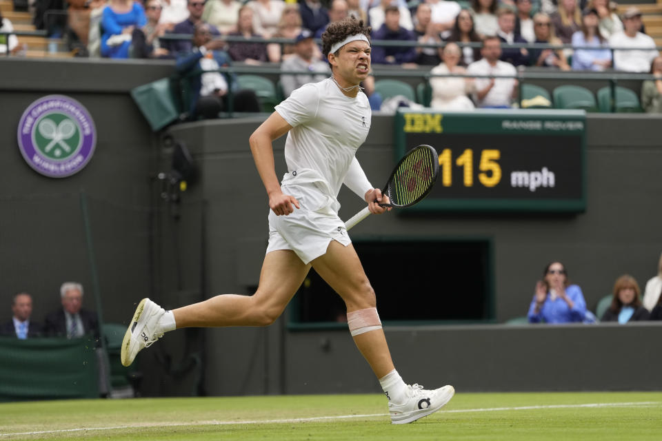 Ben Shelton of the United States reacts after winning a point against Denis Shapovalov of Canada during their third round match at the Wimbledon tennis championships in London, Saturday, July 6, 2024. (AP Photo/Alberto Pezzali)