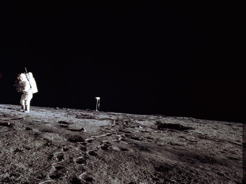 Photo of Al Bean and the TV taken from just inside the rim of Surveyor Crater.