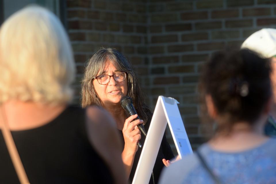 LuAnne Kozma speaks to a crowd of about 60 Hayes Township residents about the township master plan and proposed rezoning ordinances on Tuesday, Sept. 20 outside the township hall at 9195 Major Douglas Sloan Road after the township canceled the September planning commission meeting.
