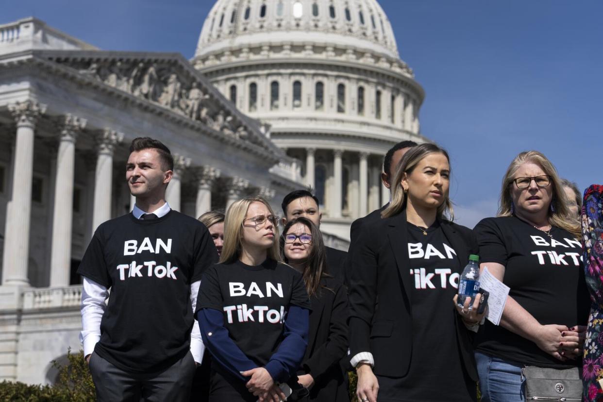 People calling for the banning of TikTok attend a news conference at the Capitol.