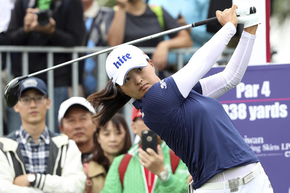 FILE - In this Oct. 31, 2019, file photo, Jin Young Ko of South Korea watches her tee shot on the first hole during the first round of the Taiwan Swinging Skirts LPGA tournament at the Miramar Golf Country Club in New Taipei City, Taiwan. Ko figures to be plenty rested whenever the LPGA Tour resumes. Ko left the CME Group Tour Championship in Naples, Florida, on Nov. 24 as the No. 1 player in women's golf, capping off her four-win, two-major season as the LPGA player of the year and winner of the Vare Trophy for lowest scoring average. The plan was to return for the Asia swing in mid-February and work her way into the season. She's still waiting. (AP Photo/Chiang Ying-ying, File)