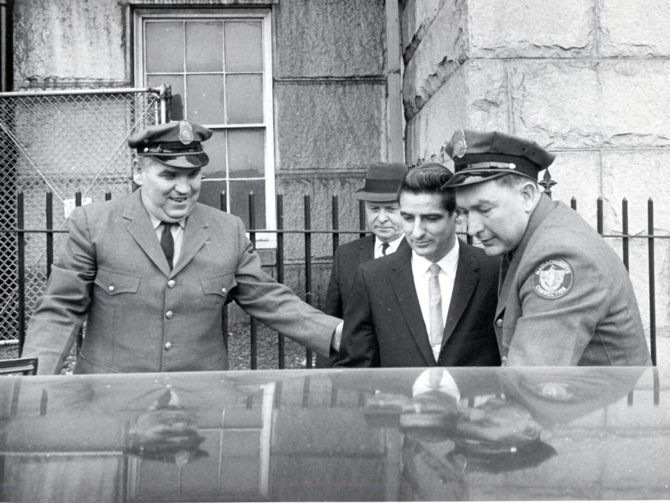 Albert DeSalvo being escorted by police in 1967.