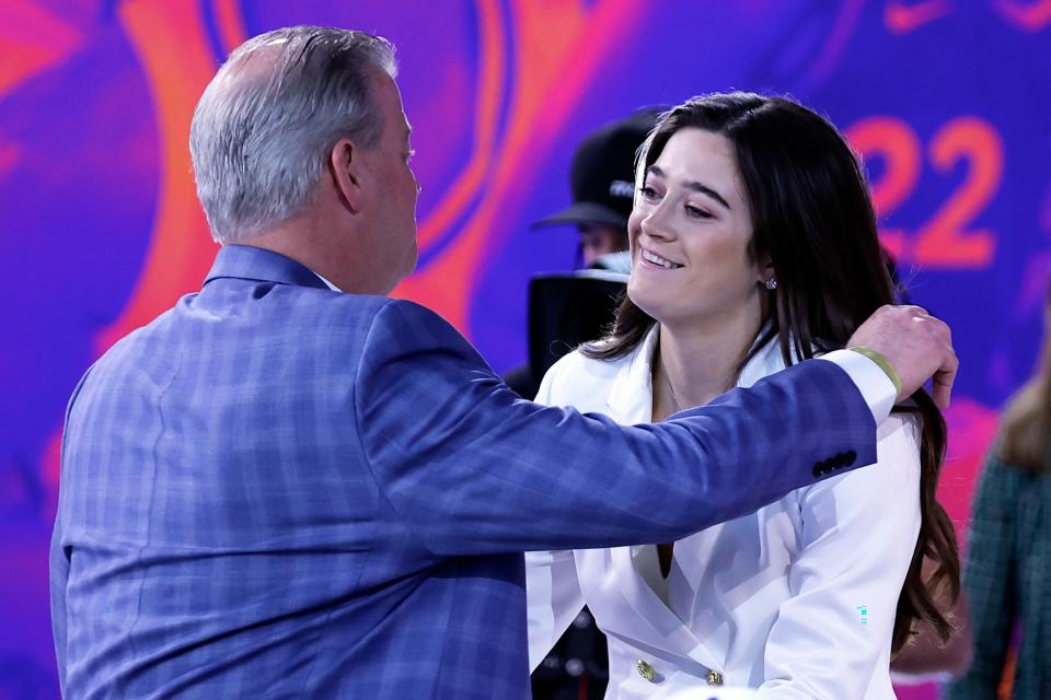 Villanova's Maddy Siegrist, right, reacts after being selected by the Dallas Wings at the WNBA basketball draft Monday, April 10, 2023, in New York. (AP Photo/Adam Hunger)