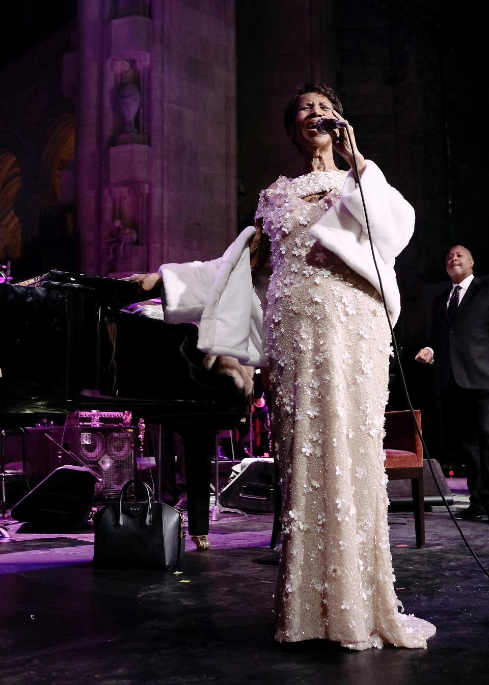 <p>At 75, Aretha Franklin was still going strong wearing a luxurious cream sequin gown decorated with floral appliqués and a white fur coat while performing at the Elton John AIDS Foundation Gala in New York City. (Photo: Getty Images) </p>