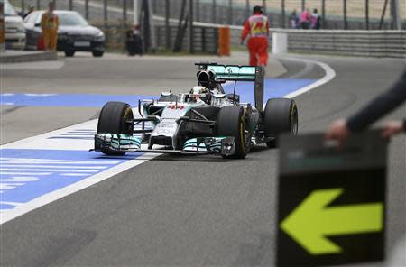 Mercedes Formula One driver Lewis Hamilton of Britain drives to a pit stop during the Chinese F1 Grand Prix at the Shanghai International Circuit April 20, 2014. REUTERS/Suki Srdjan/Pool