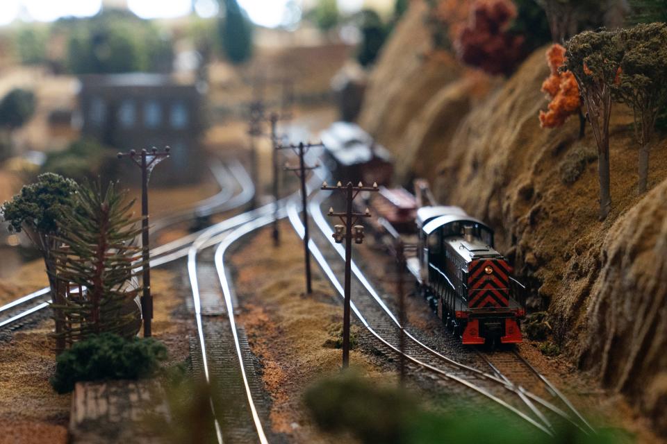 Realism is the goal in the model railroad world as a service train takes the mountain line Saturday in the Topeka Model Railroaders layout at the Great Overland Station.